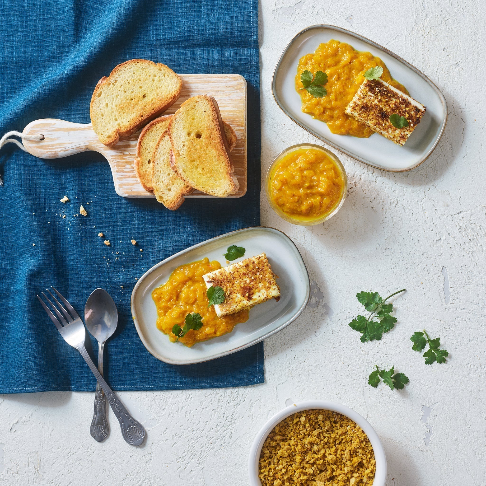 Seared feta with bread crumbs and mango sauce with White Condiment