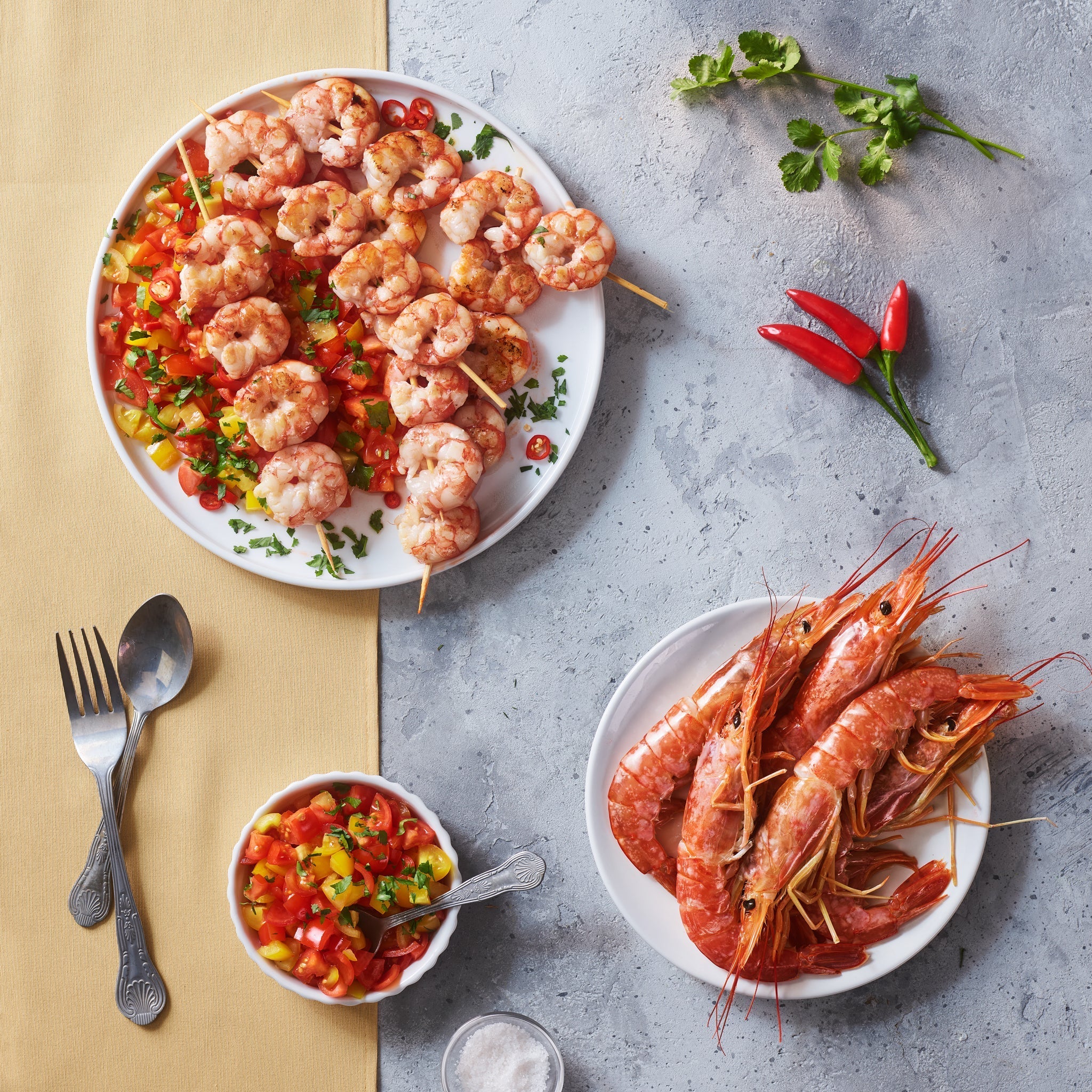 Prawn skewers with tomatoes, fresh chilli, coriander and White Condiment