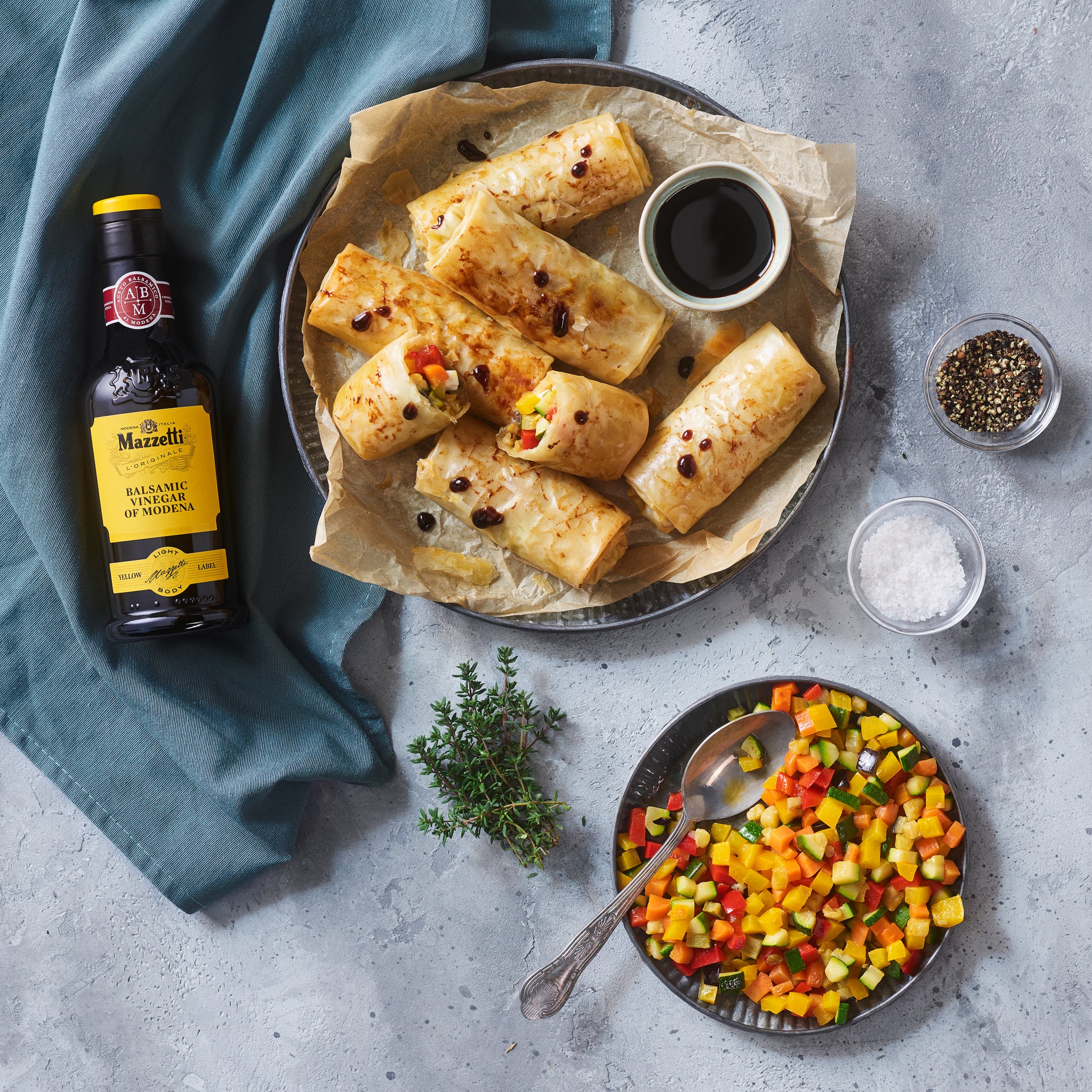 Phyllo dough rolls with diced vegetables and primosale cheese, with Balsamic Vinegar of Modena